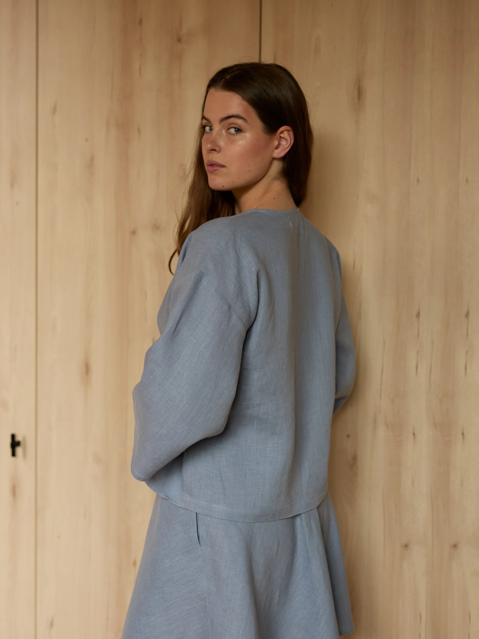 Image 3 of SOFIA linen kimono wrap top in Vista Blue, featuring a side tie closure and wide 3/4 sleeves, from Love and Confuse.