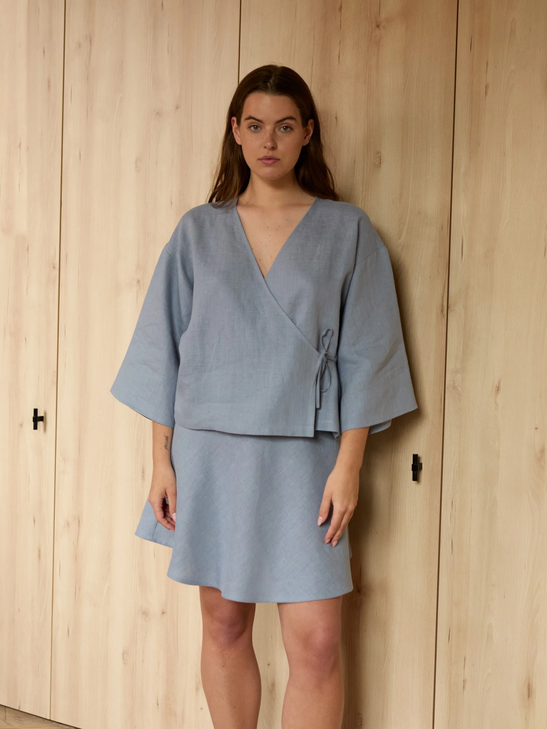 Image 4 of SOFIA linen kimono wrap top in Vista Blue, featuring a side tie closure and wide 3/4 sleeves, from Love and Confuse.